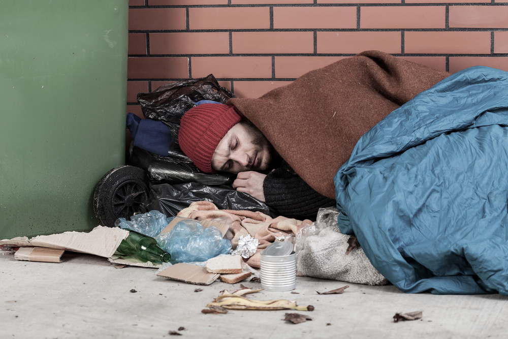 Poor man sleeping on the street, horizontal